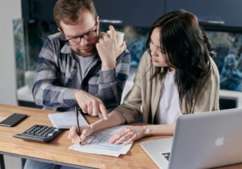 Free couple calculating al their bills stock photo